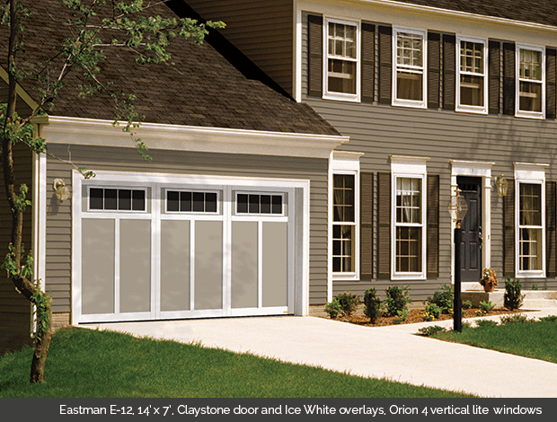 Eastman E-12 Claystone Garaga garage doors with Ice White overlays and Orion 4 vertical lite windows