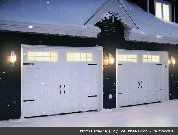 North Hatley SP in Ice White Garaga garage door with Orion 8 lite windows