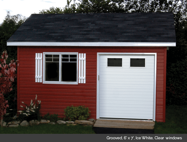 Grooved Garaga garage door in Ice White with Clear Glass windows